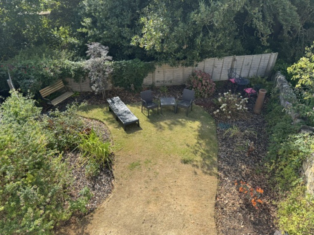 Lot: 77 - FORMER STABLE BLOCK ARRANGED AS A CHARMING COTTAGE WITH GARAGE AND GARDENS - Part of the Garden from Above